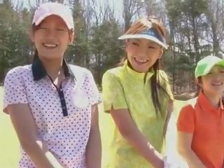 Golf harlot gets teased and creamed by two youngsters